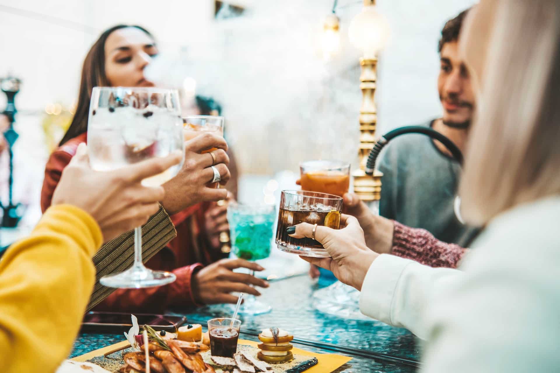 a group of people holding drinks